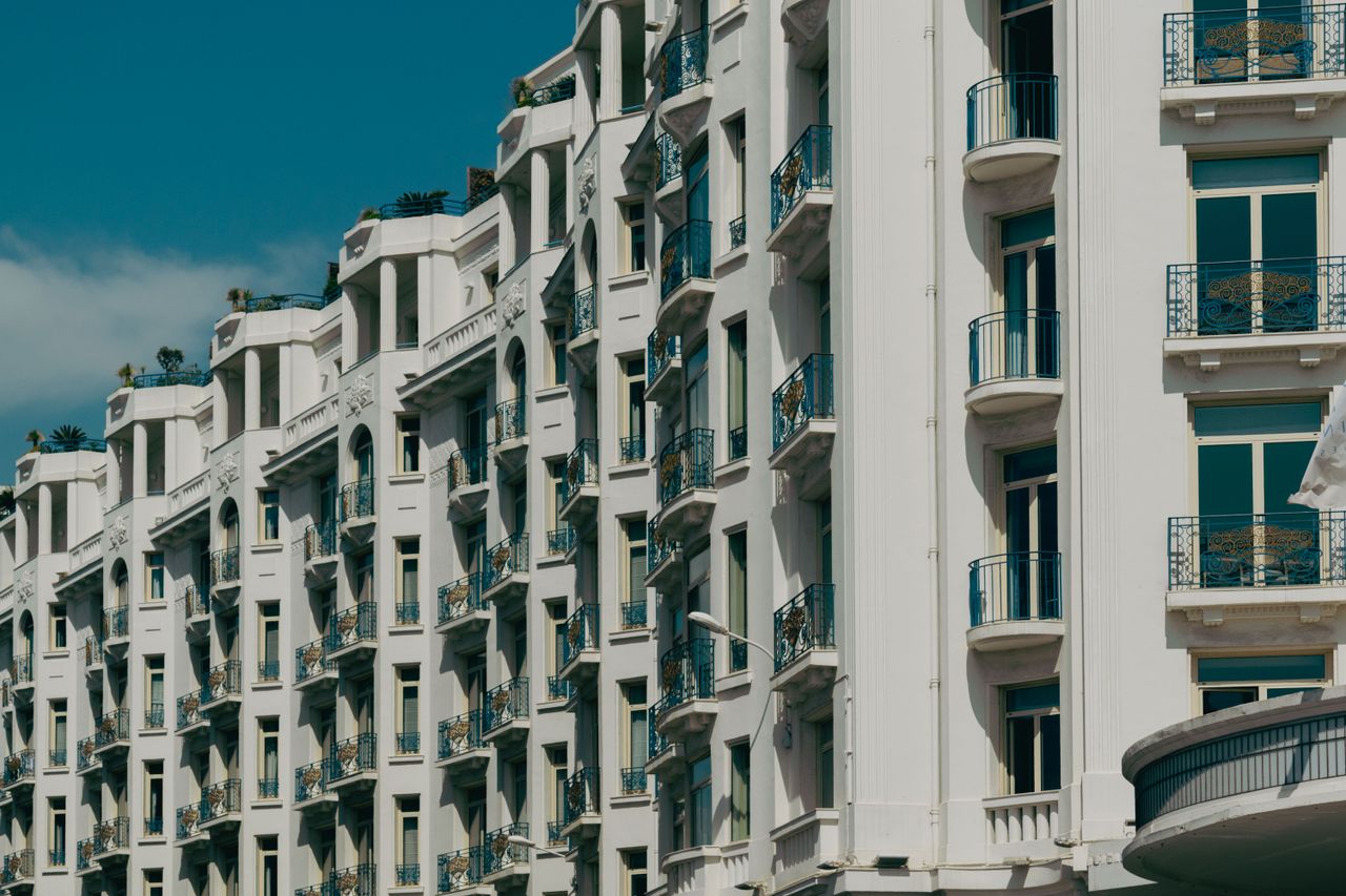 Majestic architectural design of a luxury hotel in Cannes on a sunny day.